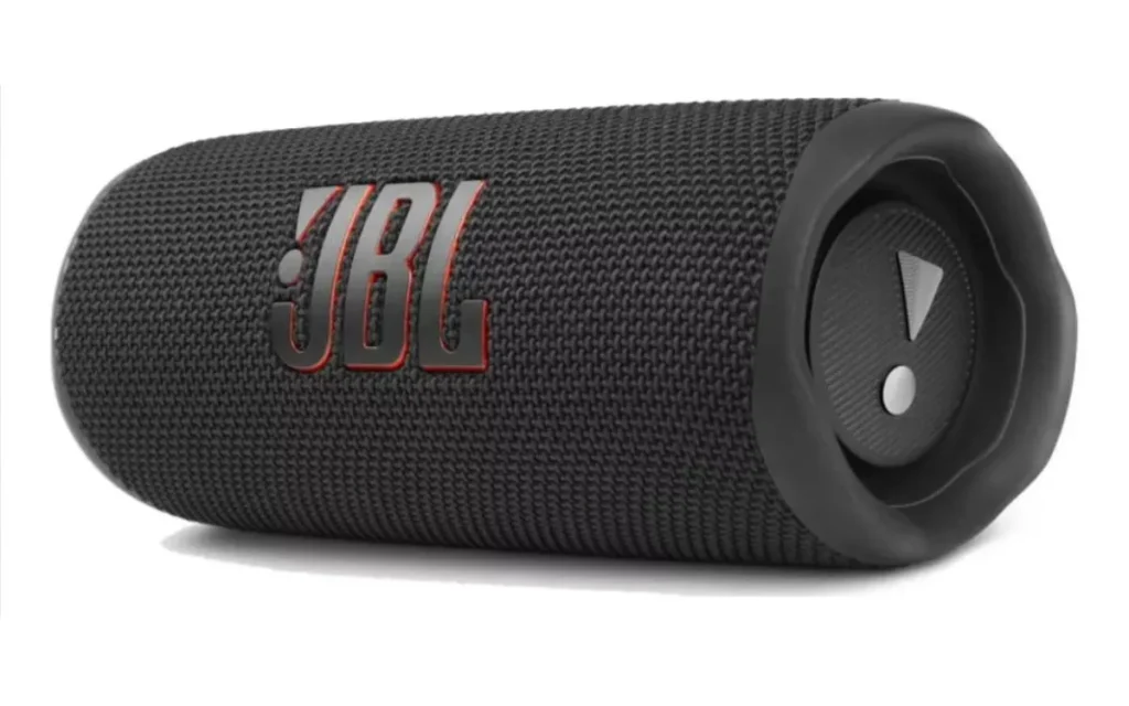 Caixa de som portátil JBL Flip 6 na cor preta, com design cilíndrico e acabamento em tecido resistente.