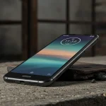 Fx Motorola Moto G75 placed on a textured concrete surface with industrial background emphasizing the phones durability and modern design 1