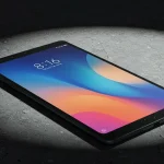 Fx Professional product shot of Xiaomi Redmi Pad SE 11 with dramatic shadow play on a textured concrete surface moody lighting 3