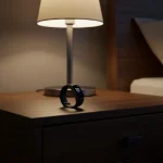 Fx Samsung Galaxy Fit3 displayed on modern nightstand with ambient bedroom lighting 1