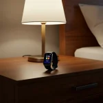 Fx Samsung Galaxy Fit3 displayed on modern nightstand with ambient bedroom lighting 4