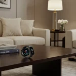 Fx Samsung Galaxy Fit3 fitness tracker positioned on designer furniture with sophisticated interior styling 3