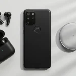 Fx Top down view of Motorola Moto G75 surrounded by tech accessories like wireless earbuds and charger on a minimalist white surface 3