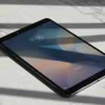 Fx Xiaomi Redmi Pad SE 11 tablet on a clean marble surface with geometric shadows high contrast artistic photography style 1