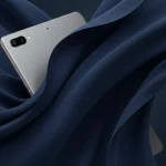 Fx Xiaomi Redmi Pad SE 11 tablet partially submerged in flowing fabric creating elegant curves luxury product photography aesthetic 3