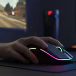 Fx Action shot of a gamers hand gripping a Redragon Cobra Pro mouse during gameplay RGB lights glowing dynamic lighting realistic scene 3