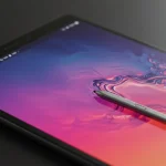 Fx Close up detailed shot of Samsung Galaxy Tab S10 FE screen displaying vibrant colors with S Pen stylus resting beside it 1