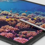 Fx Close up detailed shot of Samsung Galaxy Tab S10 FE screen displaying vibrant colors with S Pen stylus resting beside it 2