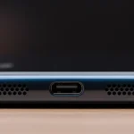Fx Close up of Xiaomi Redmi Note 13 Pro Plus 5G bottom edge showing USB C port and speaker grilles macro photography with sharp details 3