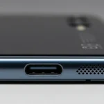 Fx Close up of Xiaomi Redmi Note 13 Pro Plus 5G bottom edge showing USB C port and speaker grilles macro photography with sharp details 4