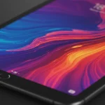 Fx Close up shot of a Xiaomi Mi Pad displaying vibrant colorful abstract wallpaper on its high resolution screen with dramatic studio lighting highlighting the display quality 3
