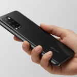 Fx Hand holding Xiaomi Redmi Note 13 Pro Plus 5G demonstrating size and ergonomics clean background natural skin tones professional commercial photography 1