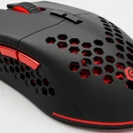 Fx High resolution product shot of Redragon Cobra Pro gaming mouse showing the honeycomb ventilation pattern on the sides detailed texture 1