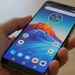 Fx Motorola Edge 60 Fusion 5G smartphone held in hand focus on realistic screen details natural skin tones high resolution 4