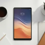 Fx Overhead shot of a Xiaomi Mi Pad surrounded by modern lifestyle objects like coffee cup notebook and succulent plants 1