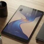 Fx Overhead shot of a Xiaomi Mi Pad surrounded by modern lifestyle objects like coffee cup notebook and succulent plants 3