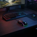 Fx Overhead view of a Redragon Cobra Pro gaming mouse on a gaming desk setup RGB lighting illuminated realistic gaming environment 1