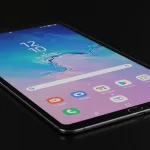 Fx Professional product shot of Samsung Galaxy Tab S10 FE with subtle reflections on glossy black surface 3