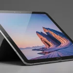 Fx Samsung Galaxy Tab S10 FE positioned at perfect angle showing screen reflection and metallic frame 2