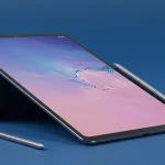Fx Samsung Galaxy Tab S10 FE with S Pen attached magnetically photographed against gradient blue background 2