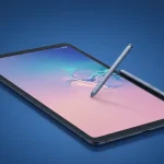 Fx Samsung Galaxy Tab S10 FE with S Pen attached magnetically photographed against gradient blue background 3