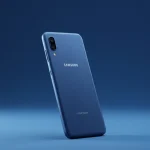Fx Samsung budget phone photographed from a low angle against a gradient blue background 3