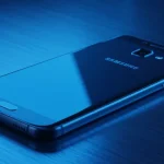 Fx Samsung budget smartphone resting on a metal surface with cool blue lighting 1