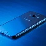 Fx Samsung budget smartphone resting on a metal surface with cool blue lighting 3