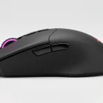 Fx Side profile photograph of a Redragon Cobra Pro gaming mouse highlighting the curved ergonomic shape and side button placement professional product photography 2