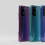 Fx Three Xiaomi Redmi Note 13 Pro Plus 5G phones in black purple and blue colors standing upright in a row clean studio setup 2