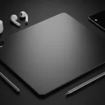 Fx Top down view of a Xiaomi Mi Pad surrounded by modern tech accessories like wireless earbuds stylus and smartphone on a dark surface 4