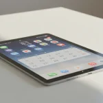 Fx Xiaomi Mi Pad tablet displaying a productivity app interface while positioned on a contemporary glass desk with natural daylight 2