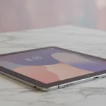 Fx Xiaomi Mi Pad tablet lying flat on a marble surface with minimalist background showcasing the devices thin profile and modern aesthetic 4