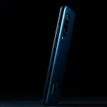 Fx Xiaomi Redmi Note 13 Pro Plus 5G positioned vertically with dramatic side lighting creating strong shadows emphasizing the phones premium texture and finish 1