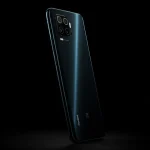 Fx Xiaomi Redmi Note 13 Pro Plus 5G positioned vertically with dramatic side lighting creating strong shadows emphasizing the phones premium texture and finish 3