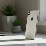 Fx iPhone 16e positioned vertically on modern desk setup natural lighting from window lifestyle context while focusing on device shallow depth of field 3